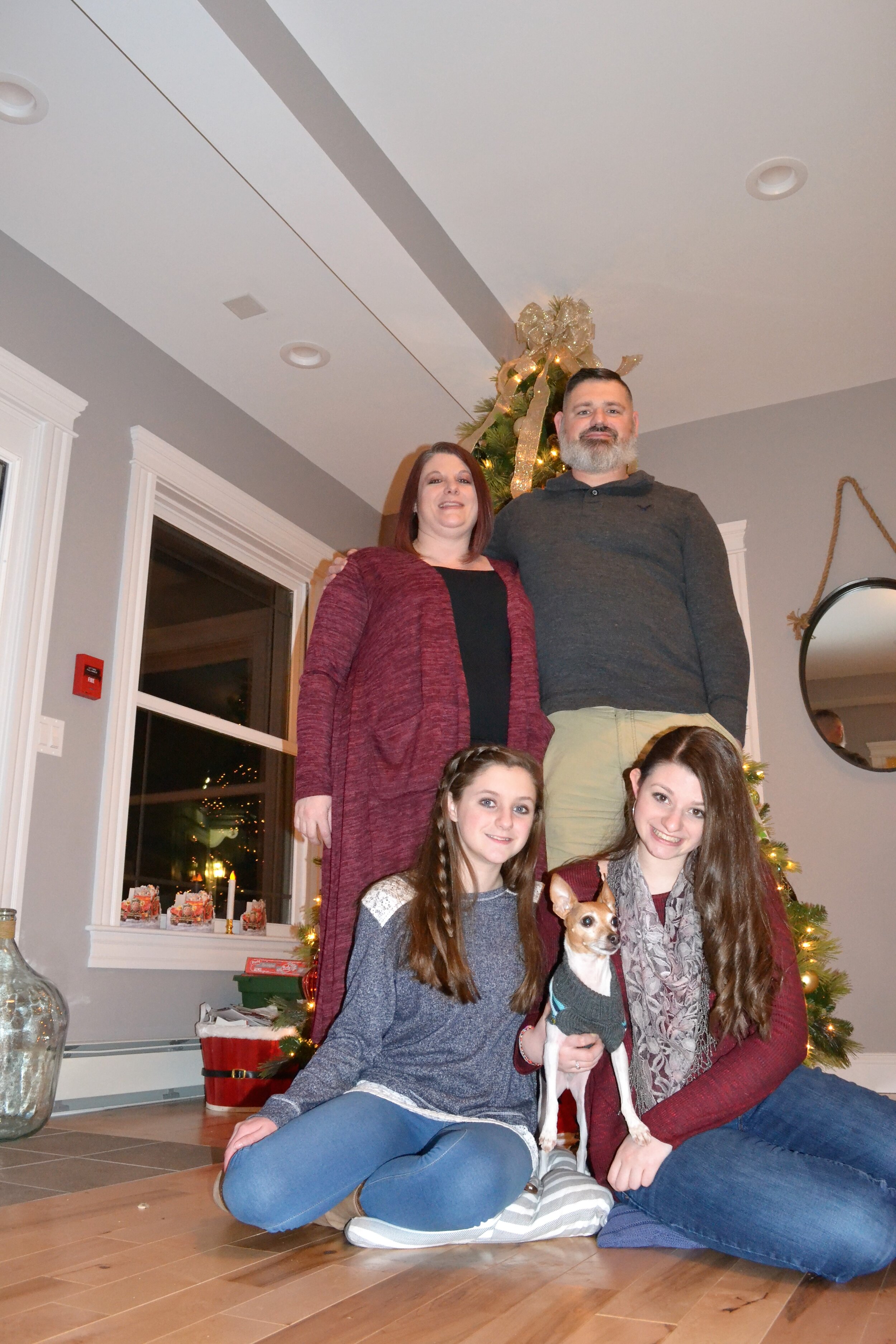 Daniel Burgess and his Family during Christmas time at the Travis Mills Foundation.