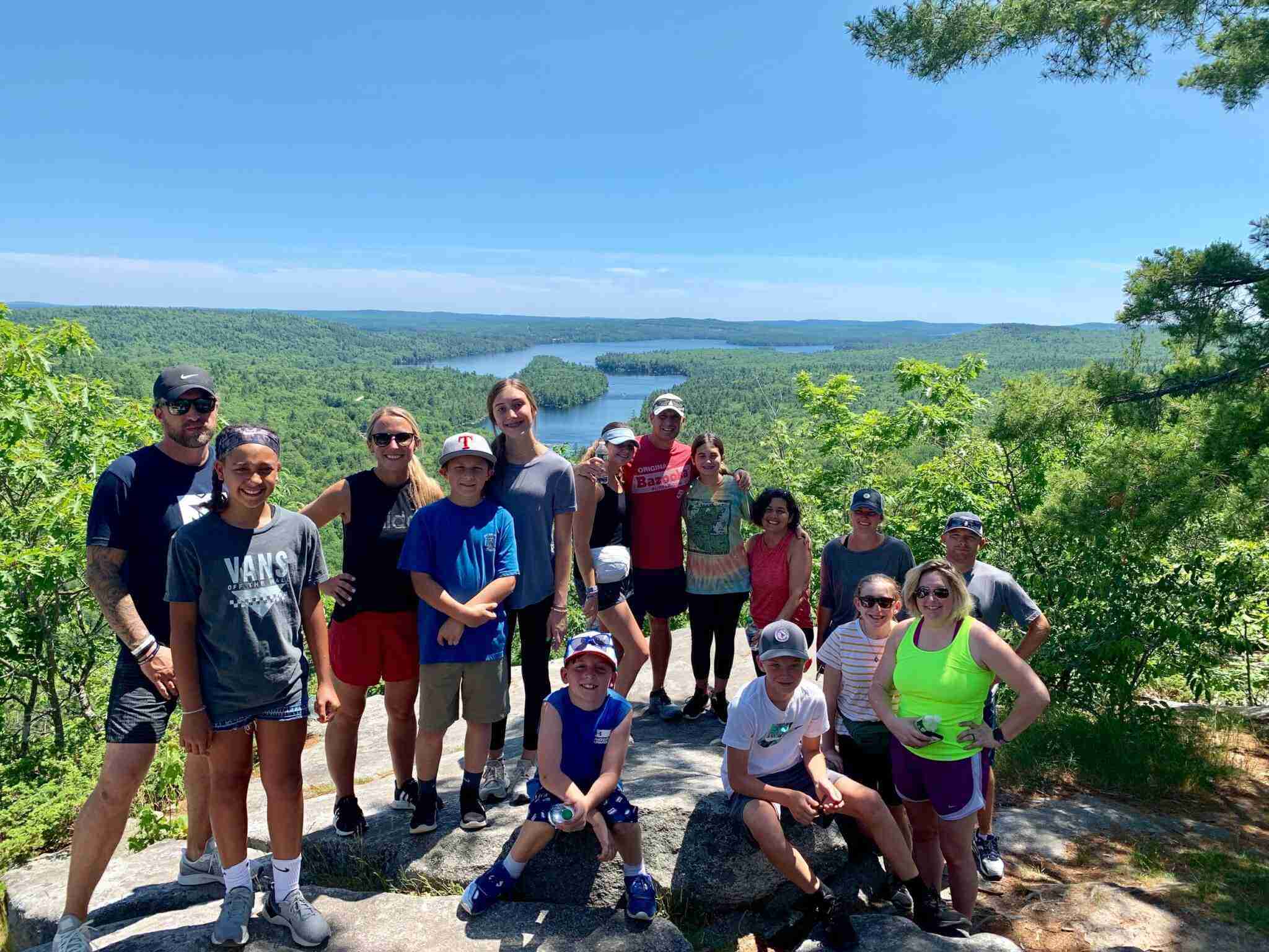 Recalibrated veteran families take a pause for a picture at the top of one of the local mountains.