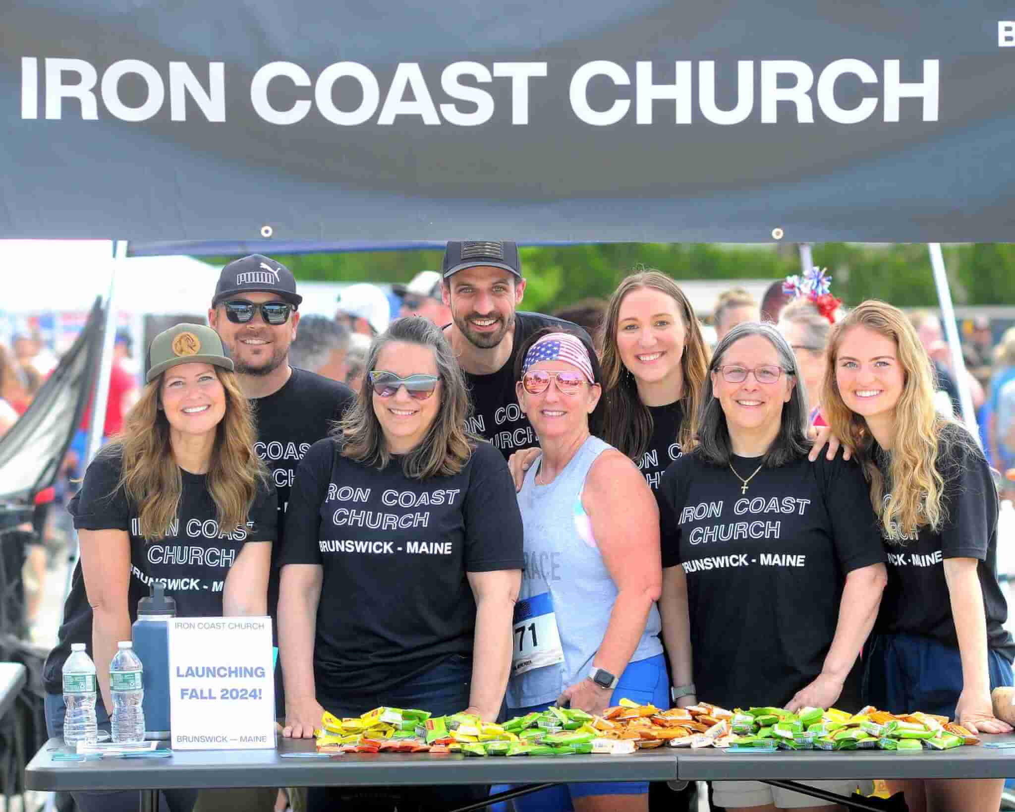 Miles For Mills booth of volunteers promoting Travis Mills Foundation