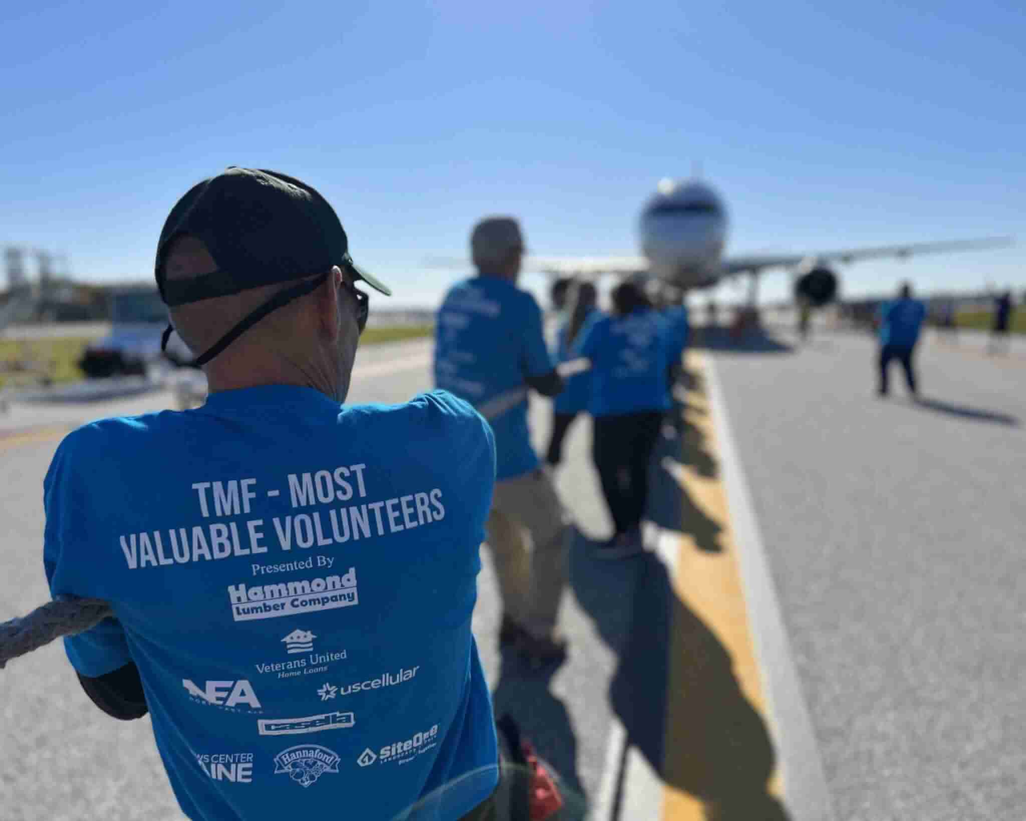 Shot of team members during Travis Mills Foundation Plane Pull in Portland, ME