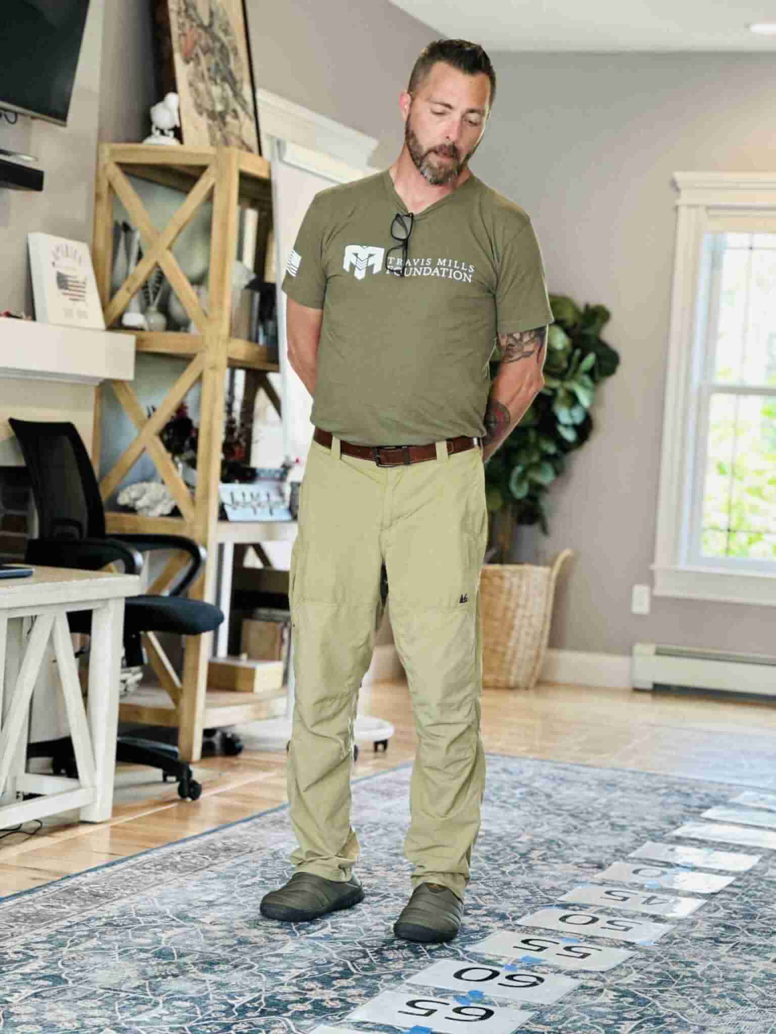 Shane demonstrates the Life Walk in the living room of the Travis Mills Foundation Veterans Retreat. In this exercise, students address past trauma and move forward with a new perspective on their life story, essentially “walking” toward a healthier, more positive future.