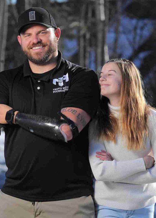 Travis Mills founder of the Travis Mills foundation based in Rome, ME.With him is his daughter Chloe. They were in East Winthrop, ME. 20230307.12C. Fred J. Fieldfredfield.com207-233-3030